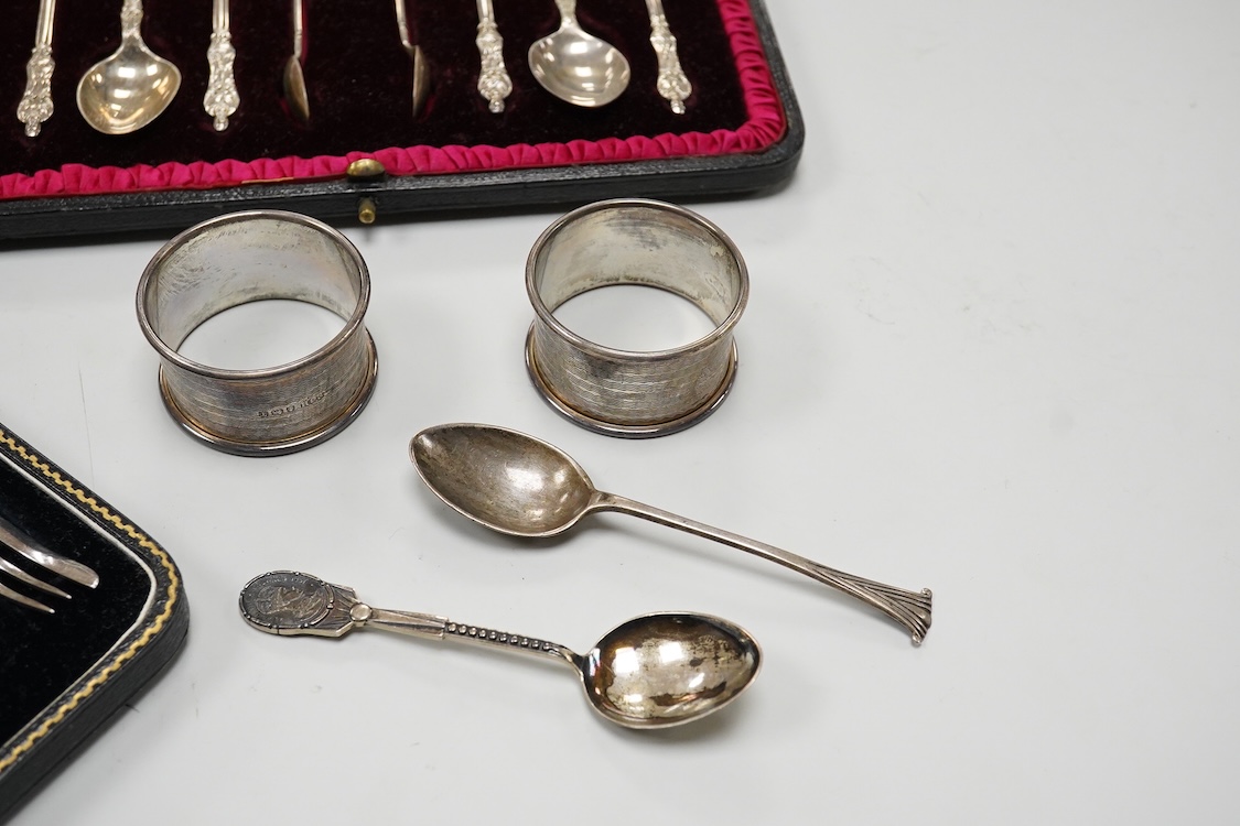 A cased set of six George V silver pastry forks, by Atkin Brothers, Sheffield, 1931, together with a cased set of six Edwardian silver apostle teaspoons and pair of sugar tongs, by Charles Stuart Harris & Sons, London, 1